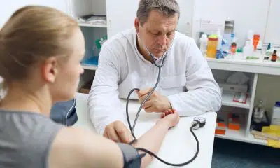 doctor measures the blood pressure