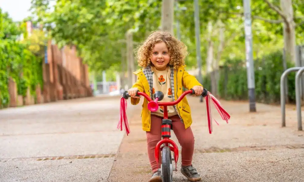 happy girl riding a pink bicycle in the park 2024 12 09 04 55 39 utc