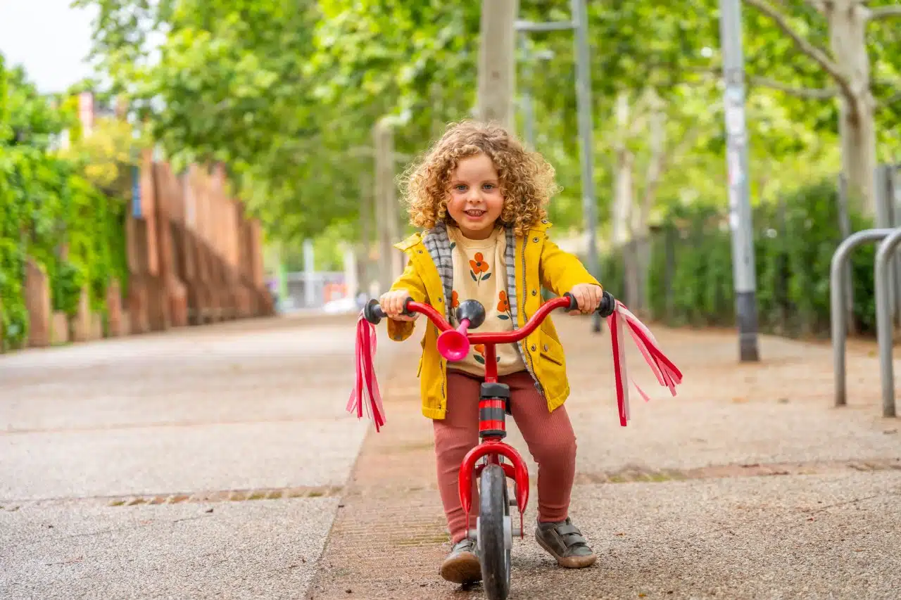 happy girl riding a pink bicycle in the park 2024 12 09 04 55 39 utc