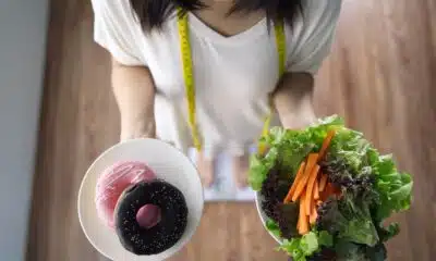 top view of woman holding dishes of vegetable sala 2026 01 09 09 45 48 utc