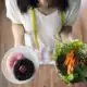 top view of woman holding dishes of vegetable sala 2026 01 09 09 45 48 utc