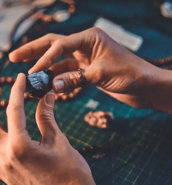 hands holding shiny stone for artistic jewelry des 2026 03 17 03 29 50 utc